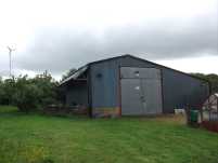 New workshop with solar panels and wind turbine